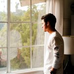 person looking out a window