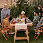 multi-generational group gathering for a meal outside