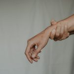 hand holding wrist