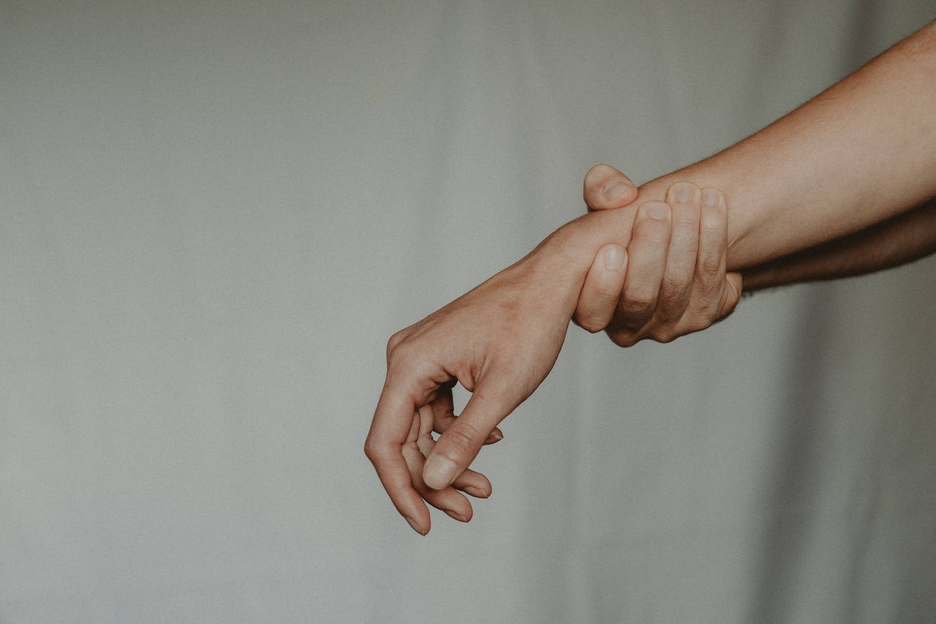 hand holding wrist