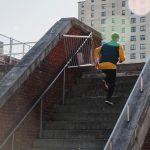 person running up some stairs outside